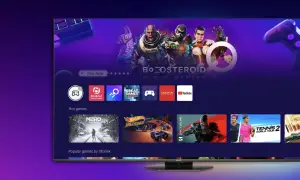 Ekran telewizora vidaa z grami w chmurze. Widoczne ikony aplikacji, gry "Metro Exodus", "Hot Wheels Unleashed" i "Tennis 2 World Tour".