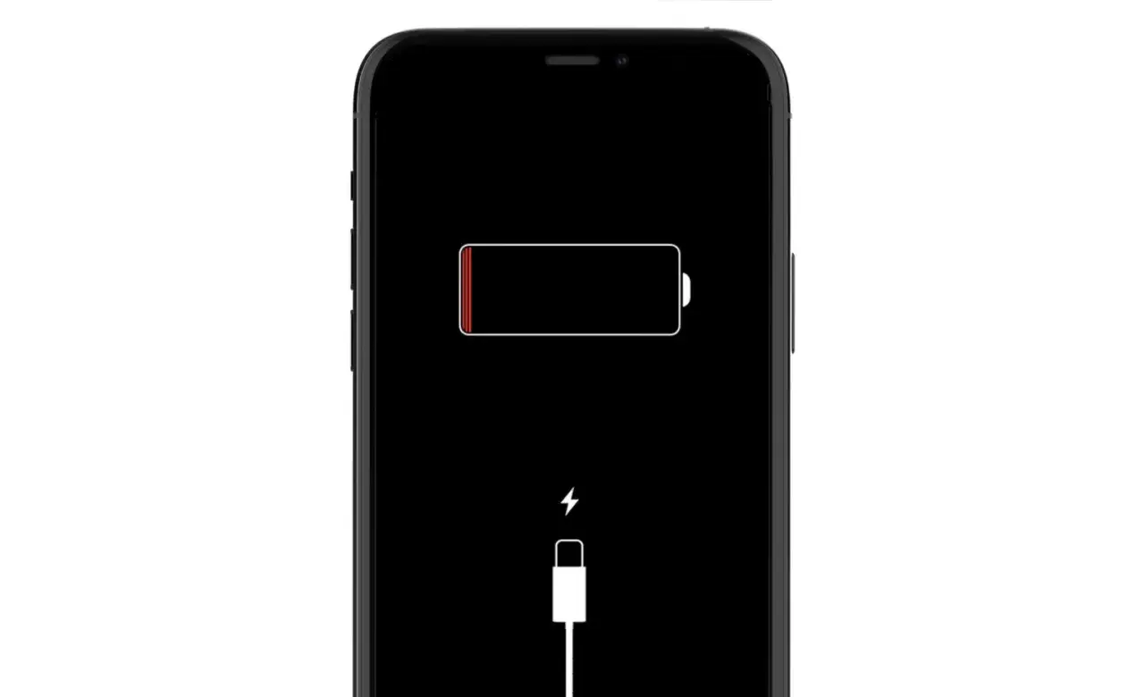 Czarny ekran iPhone'a z ikoną rozładowanej baterii i symbolem ładowania. iPhone nie ładuje się.